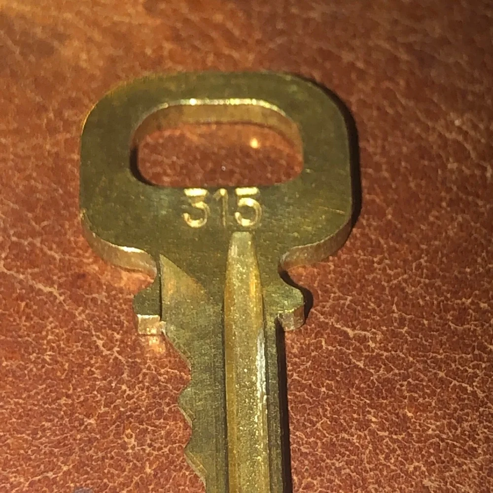 Louis Vuitton gold padlock and key set